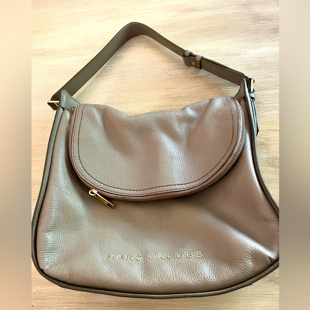 Marc Jacobs leather hobo in greige Pebbled leather zip flap for maximum storage.